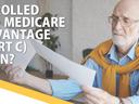 Older man reading papers; overlaid text: "ENROLLED IN A MEDICARE ADVANTAGE (PART C) PLAN?"