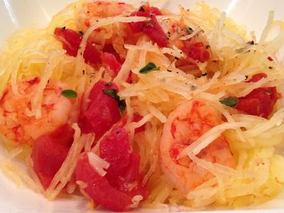 Shrimp and diced tomatoes served on shredded spaghetti squash