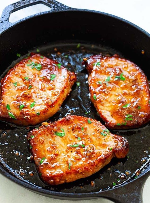 3 Honey Garlic Pork Chops on Black Skillet