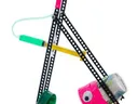 Tabletop DIY trebuchet of perforated metal strips with a syringe trigger and plastic cups