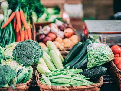 Farmers market vegetables: broccoli, carrots, zucchini, green beans, tomatoes, weighing scale