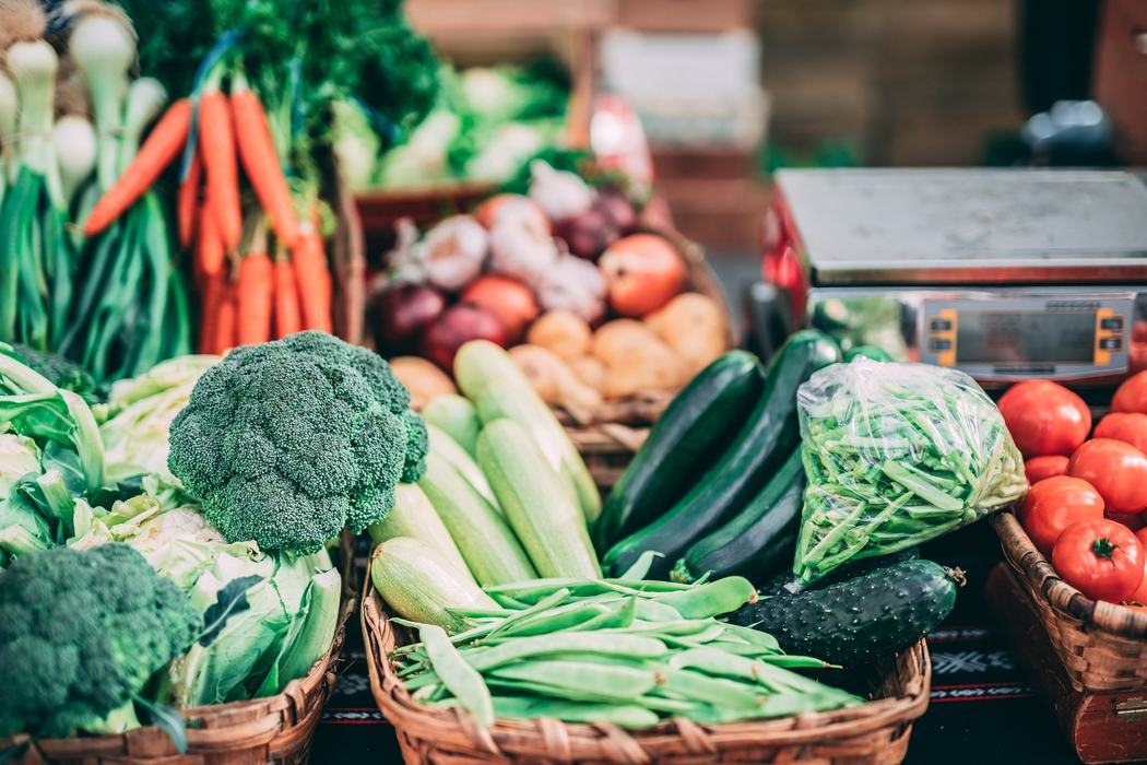 Farmers market vegetables: broccoli, carrots, zucchini, green beans, tomatoes, weighing scale