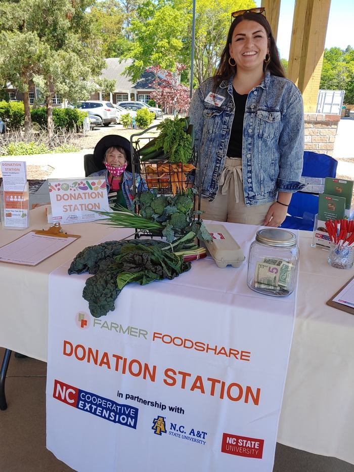 Family and Consumer Science Agent Meghan Lassiter and Volunteer working the Donation Station Booth