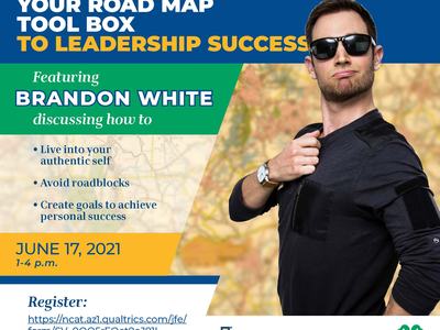 Man in sunglasses beside poster "Your Road Map Tool Box to Leadership Success", June 17, 2021