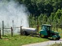 Spraying apple orchard
