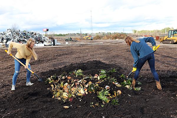 Two women with shovels