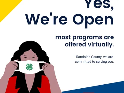 woman putting on mask with program information