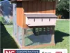 Wooden raised beehive with multiple boxes and roof on legs; "NC Cooperative Extension" logo visible