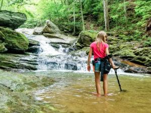Woman with metal detector