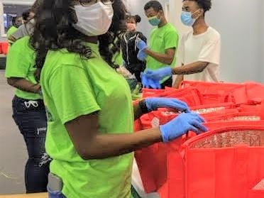 Woman in mask with green shirt