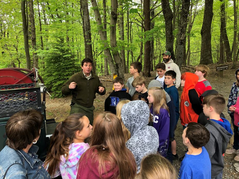 Man talking to a group of children
