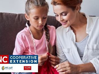 Woman guiding girl sewing red fabric; logo text: "NC Cooperative Extension"