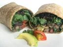 Whole-wheat wrap halves filled with black beans, lettuce, avocado and tomato