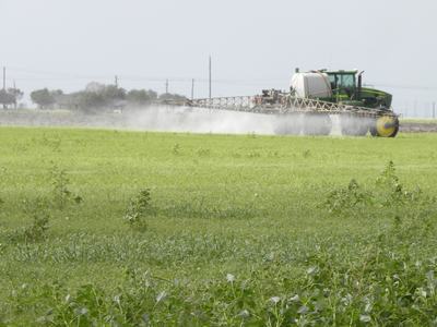 tractor spraying pasture