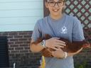 Bethany C. holding a chicken from Poultry Project
