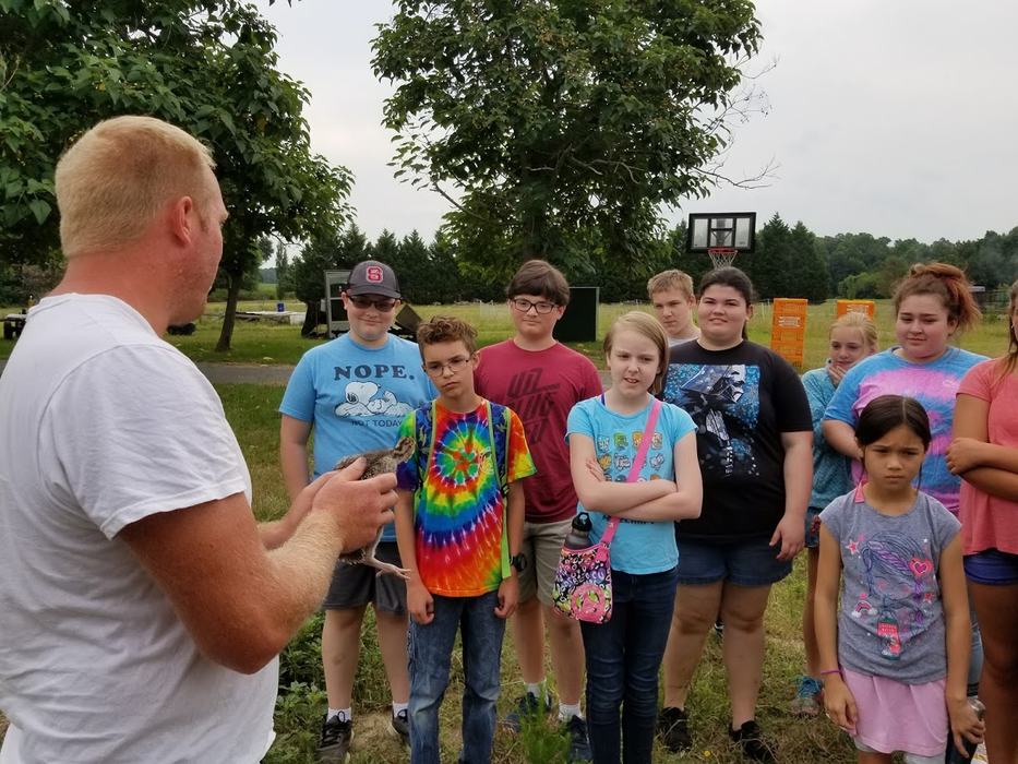 Kids listening to man speak