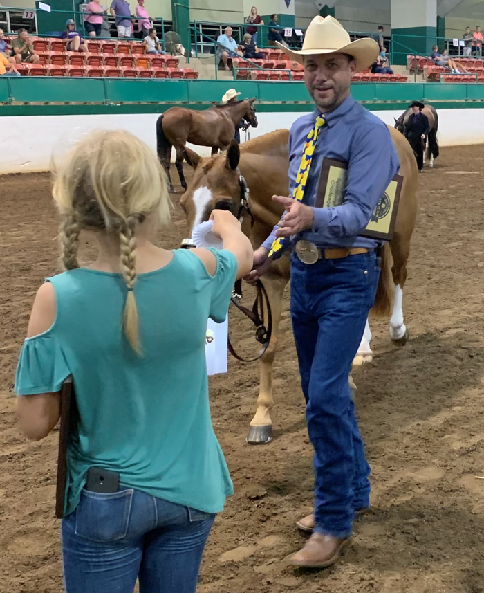 Man leading a horse