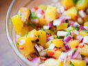 Fresh peach salsa in a glass bowl