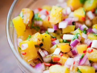 Fresh peach salsa in a glass bowl