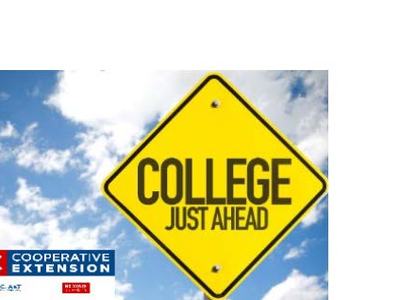 Yellow diamond road sign reading "COLLEGE JUST AHEAD" against blue sky