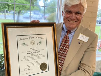 Man holding certificate