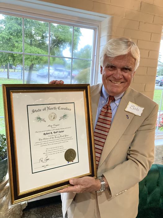 Man holding certificate
