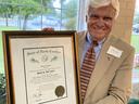 Man holding certificate