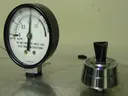 Pressure gauge on metal lid at zero; text "DO NOT OPERATE UNTIL YOU HAVE READ INSTRUCTIONS"
