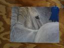 White horse painting in falling snow pinned to plywood with a blue ribbon