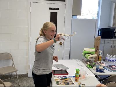 4-H - er working on a prosthetic beak.