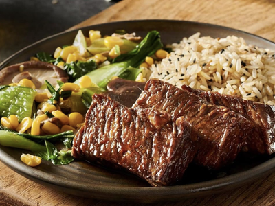 Meat, rice, and vegetables on a plate