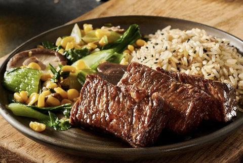 Meat, rice, and vegetables on a plate