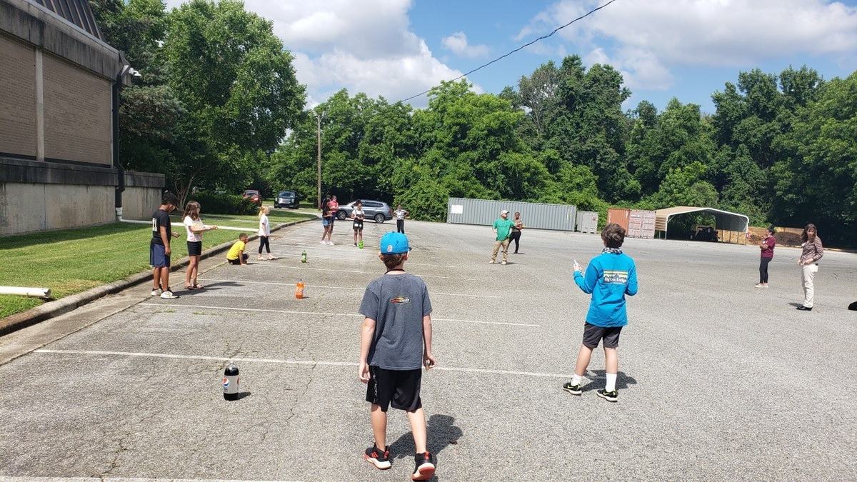 campers with soda geysers