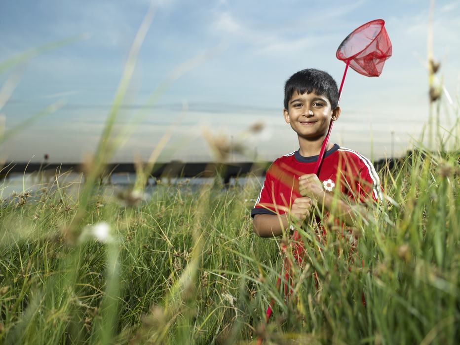 Image of a boy holding a butterfly net