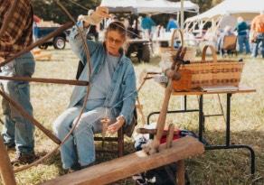 Woman spinning thread