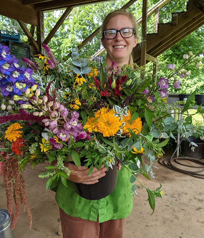 Woman holding a large flower bouquet