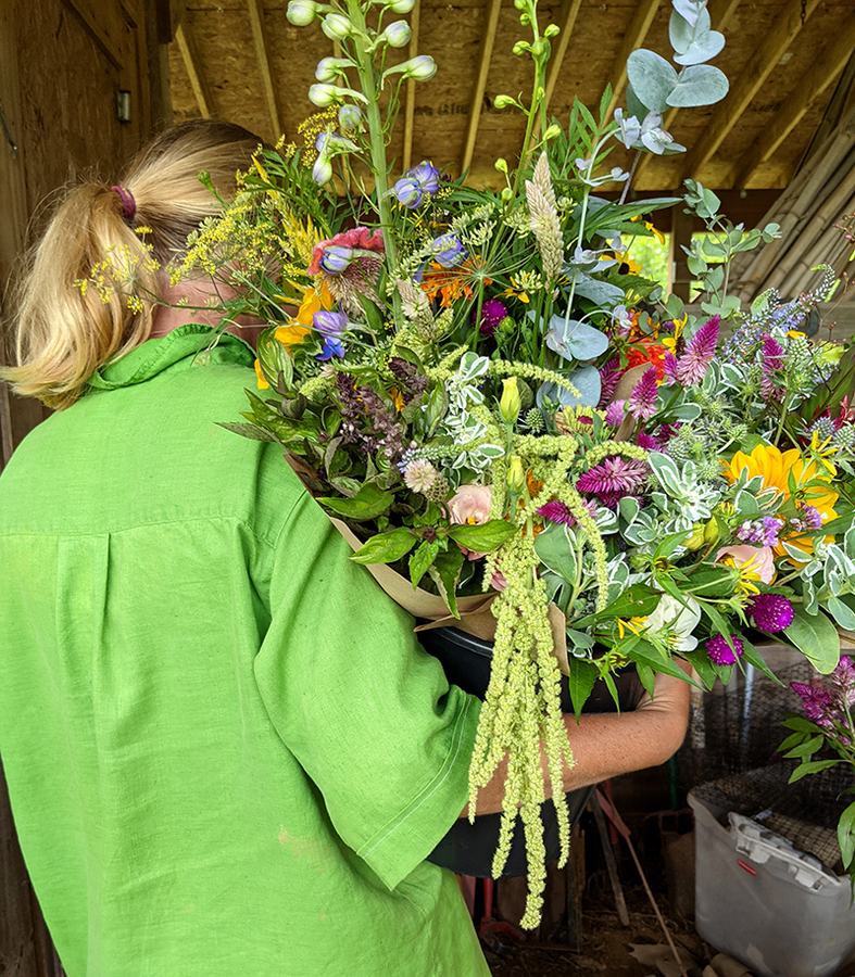 Woman holding a large flower bouquet