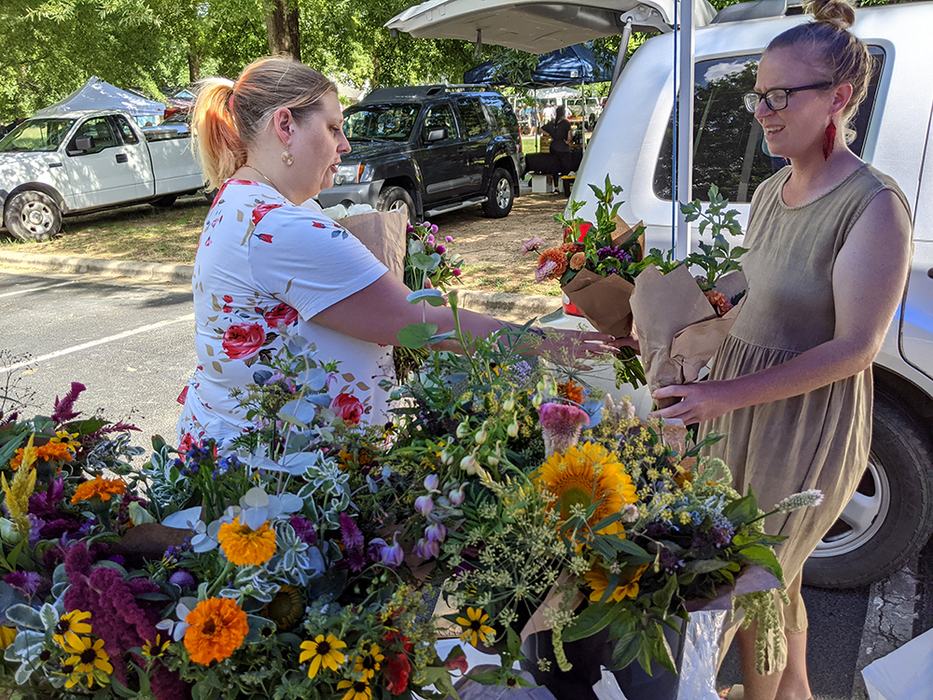 Woman buying a flower bouquet