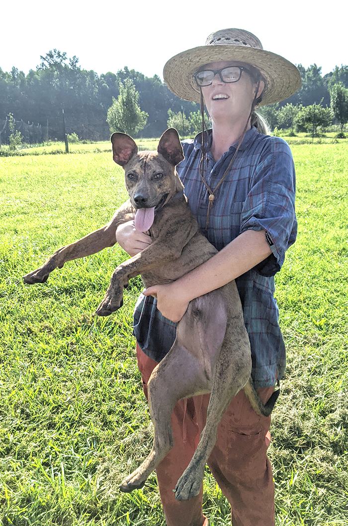 Woman holding a dog