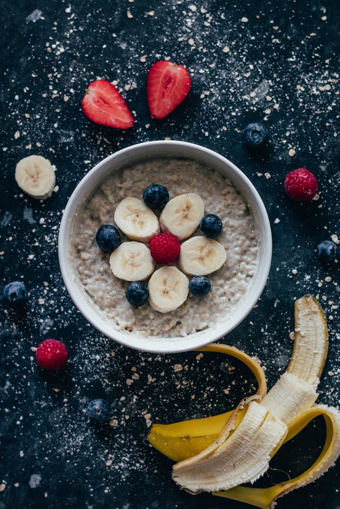 Bowl of Oatmeal with Bananas Blueberries and Raspberries 