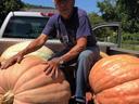 Raymond Norton with giant pumpkins on truck