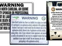 Three warning signs stating North Carolina law limits liability for farm/equine activity injuries