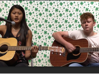 Two kids with guitars