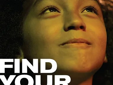 Child smiling and looking up