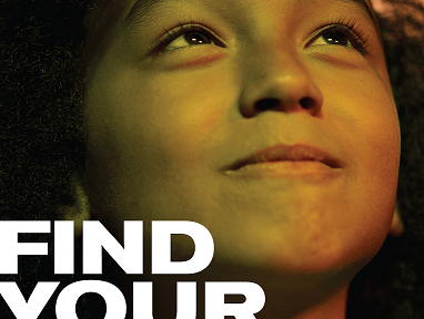 Child smiling and looking up