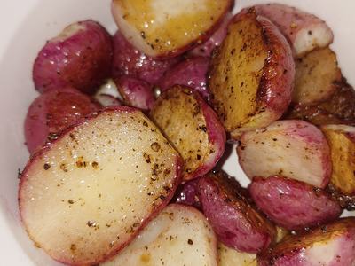 roasted radishes in a white bowl