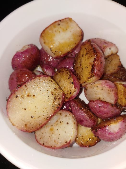 roasted radishes in a white bowl