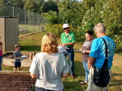Master Gardener teaching at demo garden.