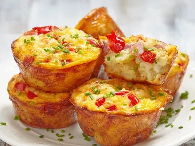 Egg Muffins on a plate sprinkled with fresh chives