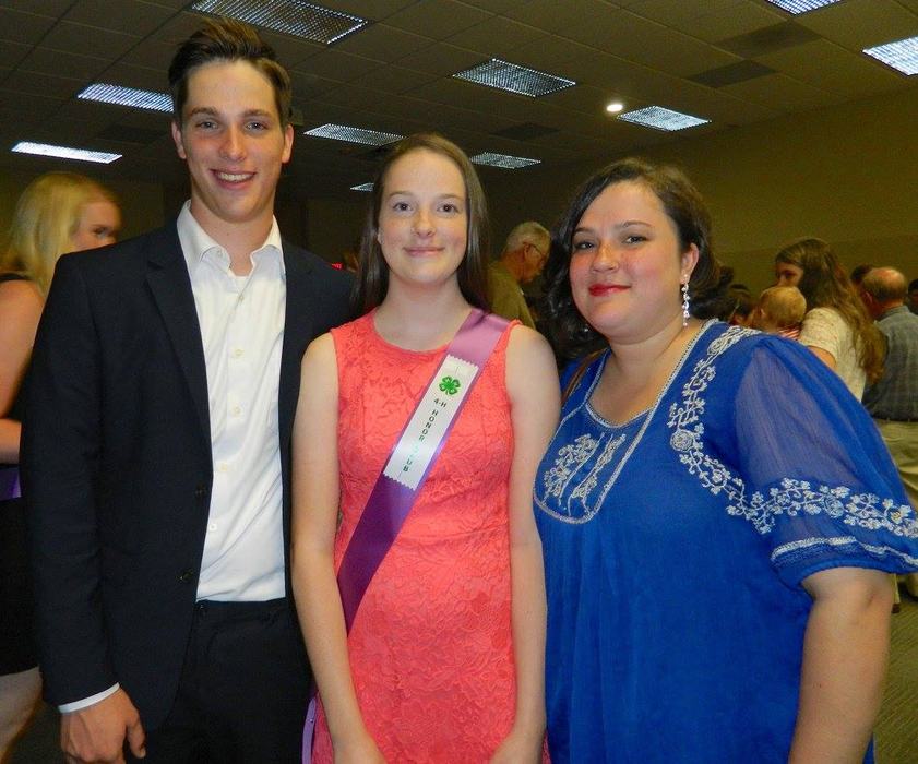 Three people smiling at camera